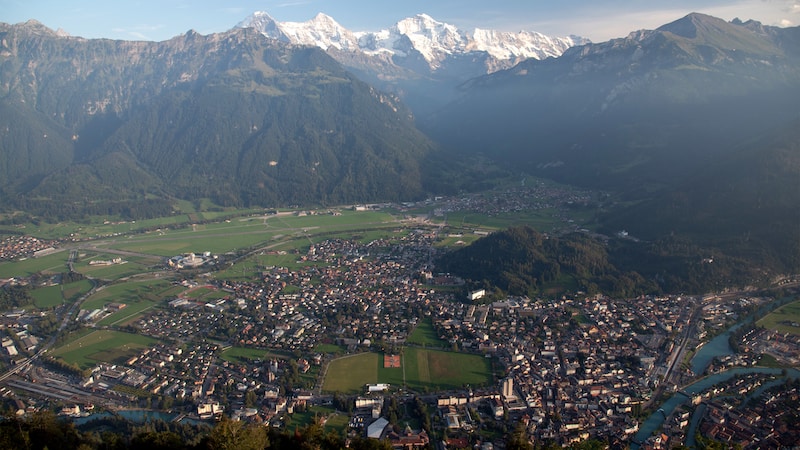 The old Swiss resort town of Interlaken is the gateway to the Berner Oberland, with its soaring alpine peaks (from left), the Eiger, Mönch, and Jungfrau. CREDIT: Rick Steves. Article bemoaning climate-caused changes at Interlaken and the Swiss Alps