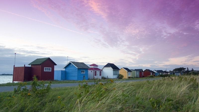 Cozy little beach houses in the town of Ærøskøbing have been lovingly tended by local families for generations. CREDIT: Rick Steves. Ride along with Rick Steves through the charming Danish Isle of Ærø, past hidden villages, U-shaped farms, windmills, a solar power plant, churches, beaches, prehistoric burial grounds, and more.