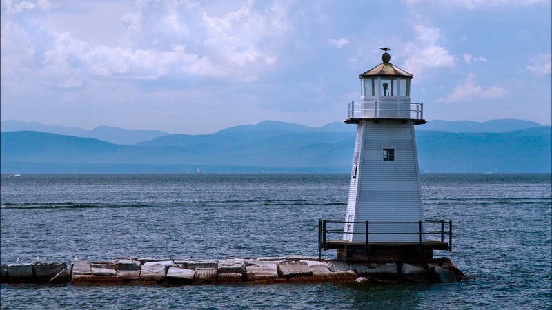 Burlington Breakwater Lighthouse Lake Champlain, Vermont, by Alwoodphoto. Visit Vermont in three enjoyable towns: Burlington on Lake Champlain, Manchester, Brattleboro for recreation, shopping, dining, and more.