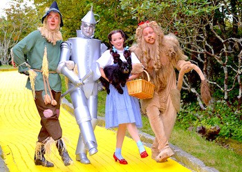 The scarecrow, tin man, Dorothy, and cowardly lion on the yellow brick road at the Land of Oz in Beech Mountain, North Carolina