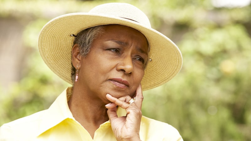 A woman looking concerned. From Monkey Business Images. For article on hurtful sorority sisters 45 years later.