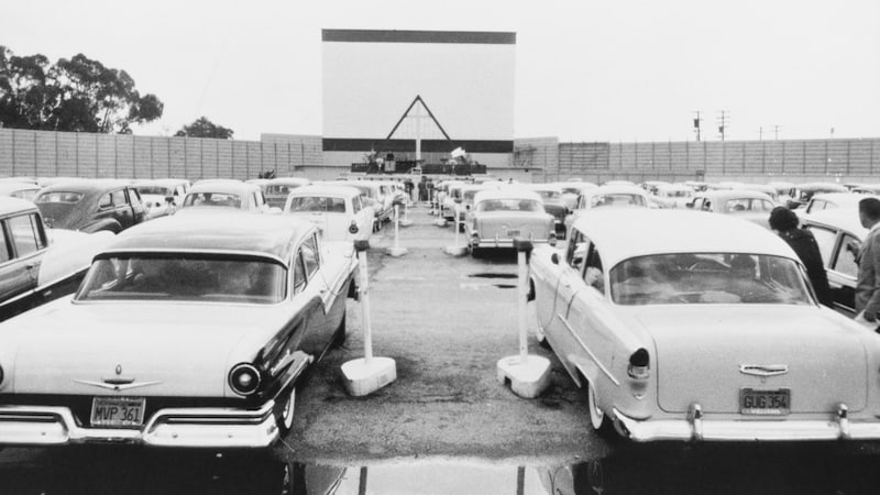 a drive-in movie theater in the 1960s, from Everett Collection. The first drive-in movie theater opened in 1933, giving birth to memories of drive-in movies for many people, like this fond remembrance. 