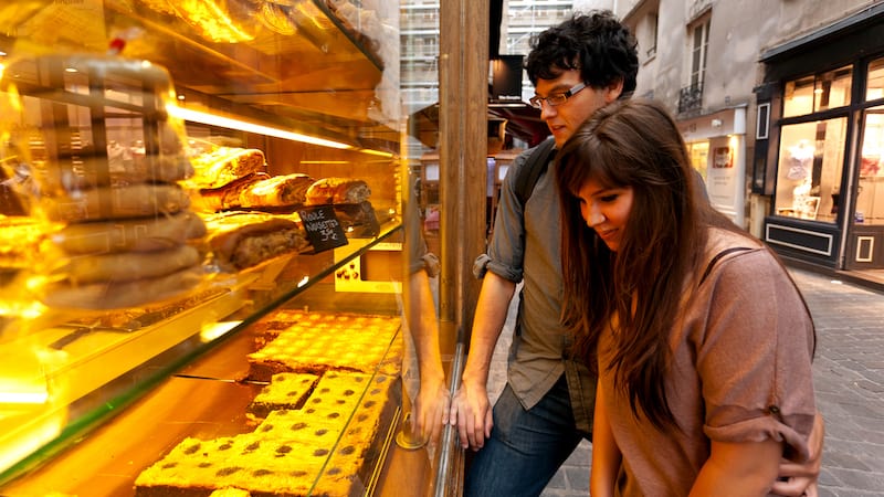 Parisian market streets: Parisians make several stops in their grocery routine—at the fromagerie for cheese, the charcuterie (or boucher) for meats, and the boulangerie for freshly baked bread. CREDIT: Rick Steves.