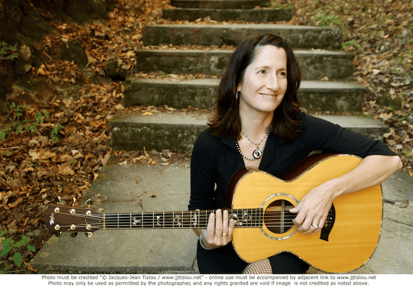 Singer Kate McDonnell with her guitar. Kate McDonnell's publicity photograph; it should be credited to Jacques-Jean Tiziou http://www.jjtiziou.net