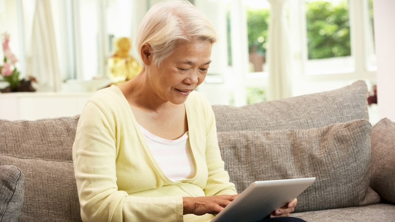 Asian woman on tablet, from Monkey Business Images. Used with Boggle BrainBuster country clues.