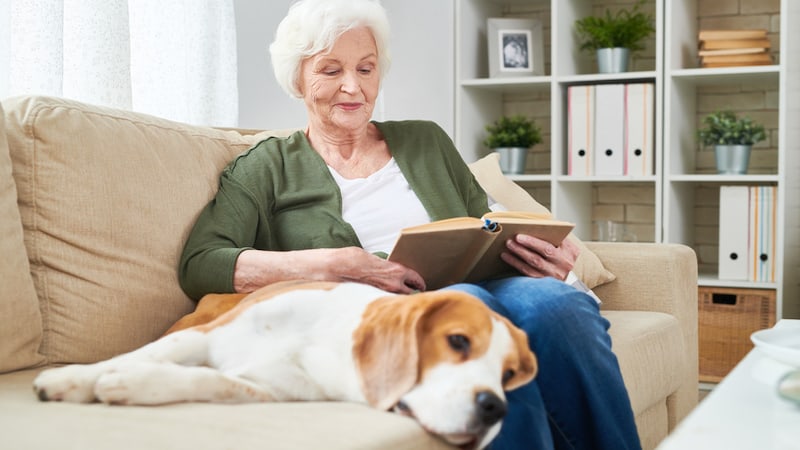 Senior woman on a couch with a dog. Credit Seventyfourimages. After 6 years of daily visits, a woman is done with dog sitting her grown children's dogs and wants her own time. See what "Ask Amy" advises.