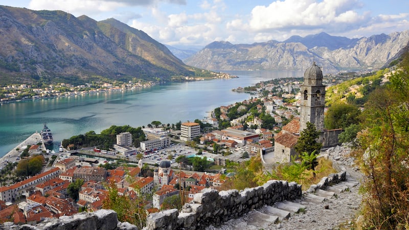 In this piece of Montenegro, Kotor's zigzagging town wall rewards climbers with a spectacular view of the city, water, and mountains. CREDIT: Rick Steves.