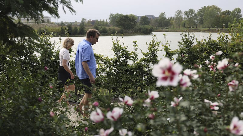 Visitors walk through the the Mitsuzo and Kyoko Shida Evaluation Garden at the Chicago Botanic Garden in Glencoe on Oct. 4, 2023.