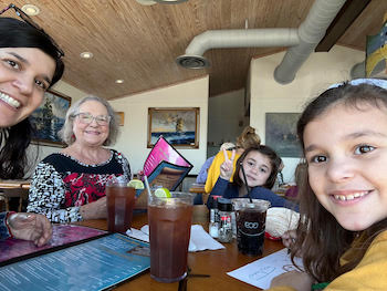 Sherrill “Nana” with a daughter-in-law and two youngest grandchildren at a restaurant in Rockport, Texas 2023