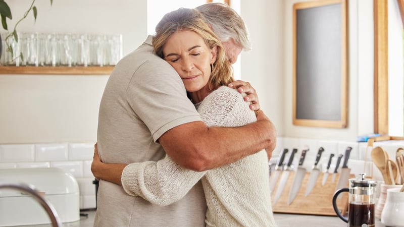 A loving couple in an embrace, for an article on a couple who was disappointed in a narcissistic friend and wonders if the behavior is a friendship-ender. Image by Yuri Arcurs