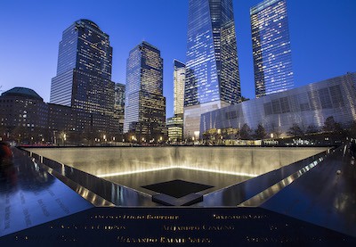 9/11 Memorial & Museum — Memorial Plaza and South Pool at dusk. Photo by Jin S. Lee / 9/11 Memorial. For use with New York CityPass article