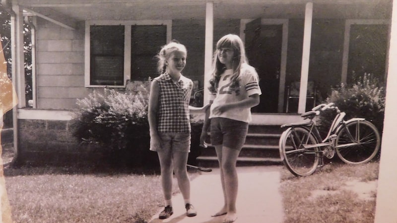 Writer Julia Nunnally Duncan (in ball jersey) and her friend, Edna, standing on the front walk featured in the story, circa 1967.