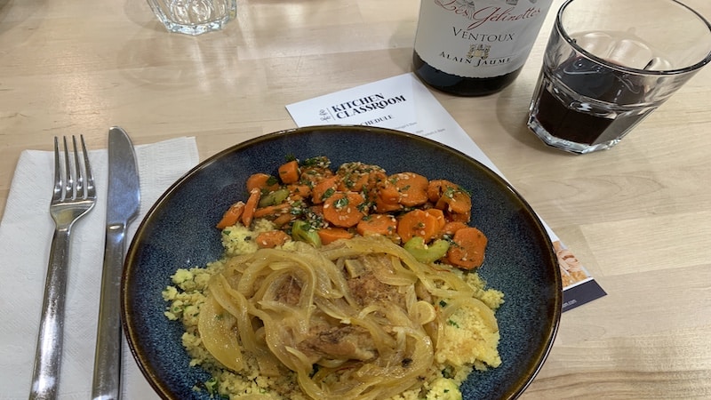 A Moroccan meal of couscous, chicken, and carrots