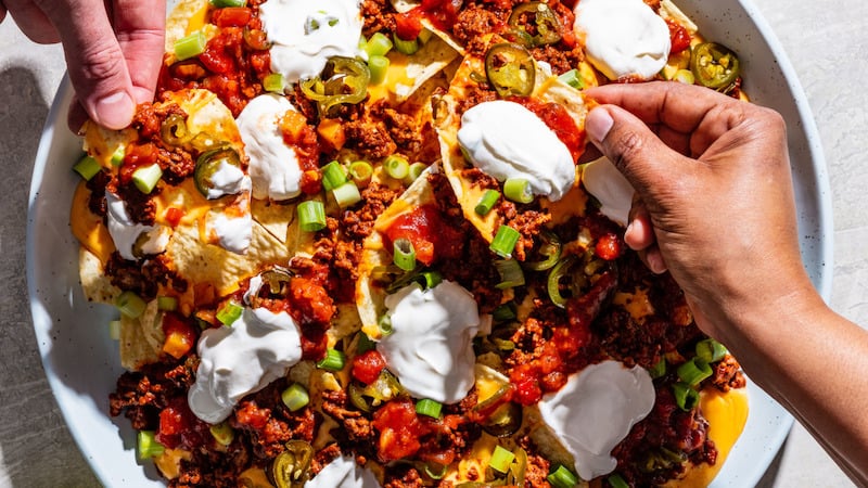 Ground beef nachos, with sour cream, jalapeños, cheese, beef, and other delicious toppings