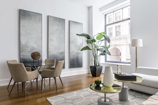 A living room in an old home with space-saving shapes.