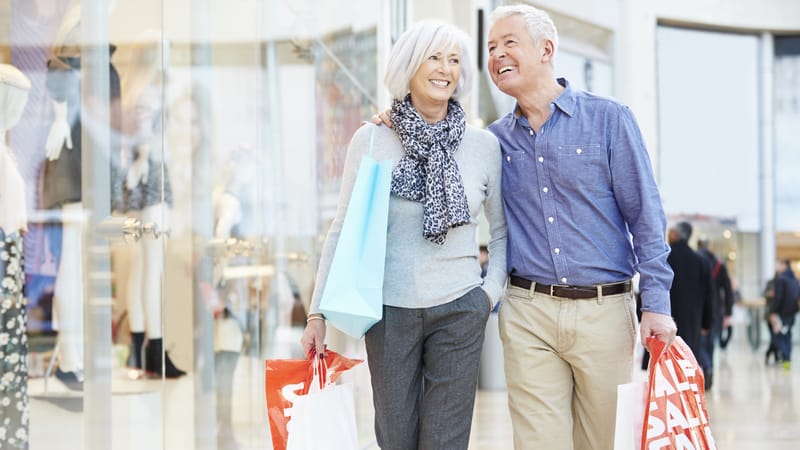 couple shopping, image by Monkey Business Images. Despite economists' warning about the recession, the U.S. economy has been resilient, as demonstrated by many factors, including high rates of shopping.