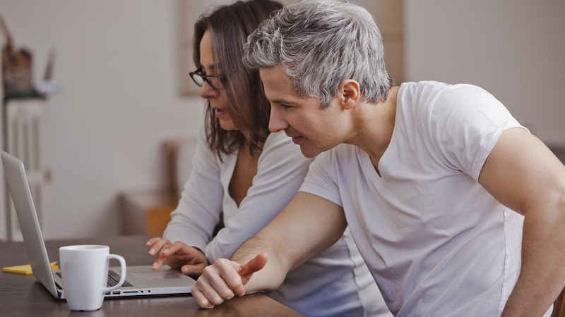 couple on laptop, perhaps doing a puzzle. Image by Laindiapiaroa. For this week's Boggle puzzle on countries with A at the beginning and end