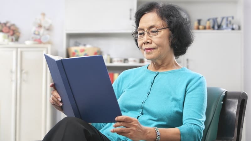 A woman reading a book. Image by Otnaydur. Article: ‘I Want Alone Time,’ Says a New Empty Nester