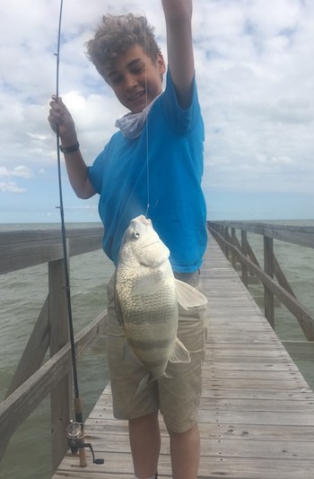 Sherrill’s oldest grandchild, Cal, catching a big fish off his grandparent’s community pier near their vacation home before leaving Rockport, Texas. Photo: Spring break, 2017