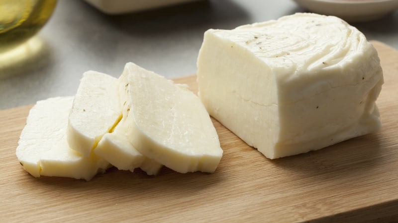 halloumi cheese on a cutting board, used with recipe for halloumi fries. Image by Picture Partners