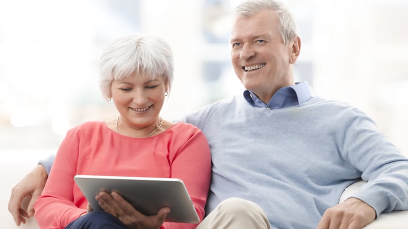 two adults on tablet Sepy67. Used with Boggle search for consonants and countries