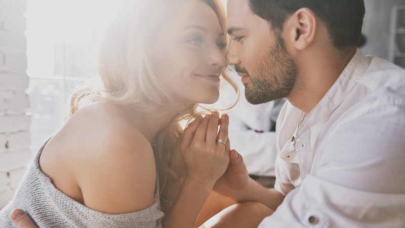 A young couple in love embracing, woman and man. Image by Gstockstudio1. Article: Should Daughter’s Boyfriend Share Her Bedroom?