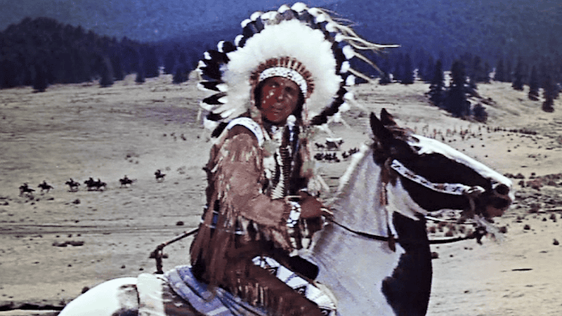 This image is a screenshot from a public domain trailer for the 1954 film, "Sitting Bull." Iron Eyes Cody was most widely recognized as "The Crying Indian" in the 1971-released environmental ad campaign.