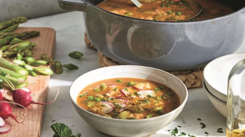 With fresh spring vegetables come new delicious and nutritious menu items for our tables. This spring vegetable and orzo soup includes asparagus spears and peas for a warming soup on a spring day.