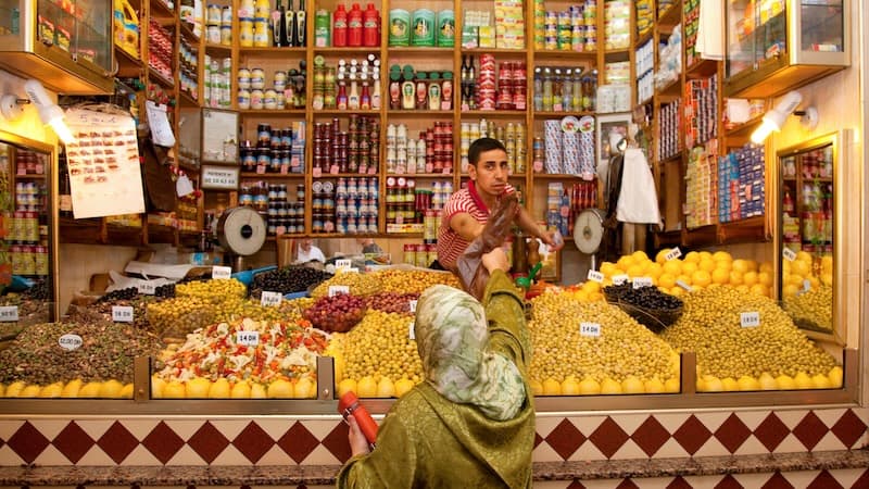 The market in colorful Tangier, Morocco, boasts piles of fruits, veggies, and olives, countless varieties of bread, and nonperishables, like clothing and electronics.