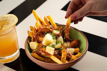 poutine and cocktail at Gather & Hem