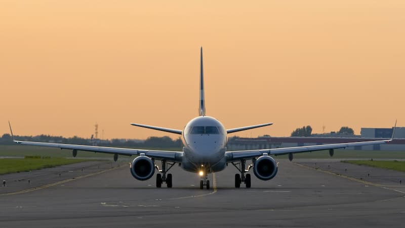 airplane on the runway, for article on airfares and other airline projections for summer 2024