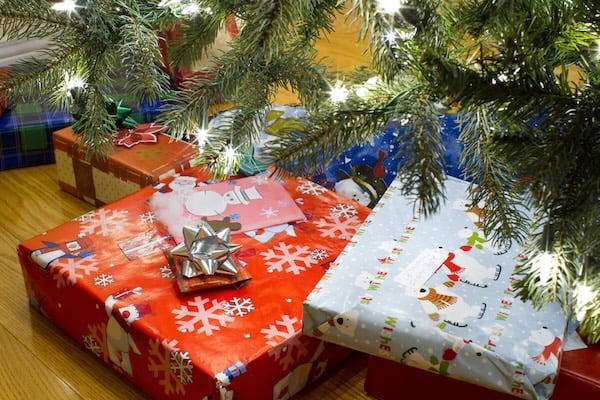Christmas tree with gifts underneath. For What's Booming May 29
