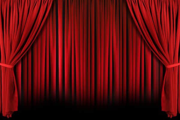Curtains on a stage, closed. For the announcement of Virginia Rep's new season, in What's Booming May 22