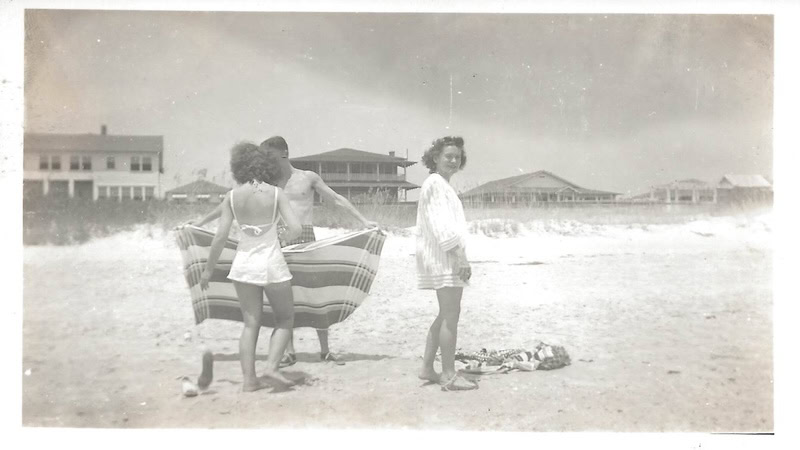 Beach memories: A young couple getting set up on a beach in the late 1940s or early 1950s at Myrtle Beach.