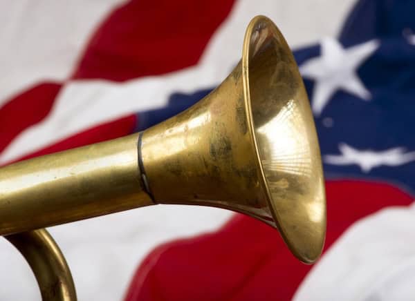 A brass bugle on an American flag to represent patriotic music, promoted in What's Booming, June 6
