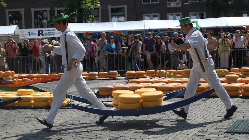On Friday mornings between April and August in Alkmaar, Netherlands, cheesemakers neatly line up their cheeses for prospective buyers to examine, a highlight of Europe for cheese lovers. CREDIT: Cameron Hewitt, Rick Steves’ Europe
