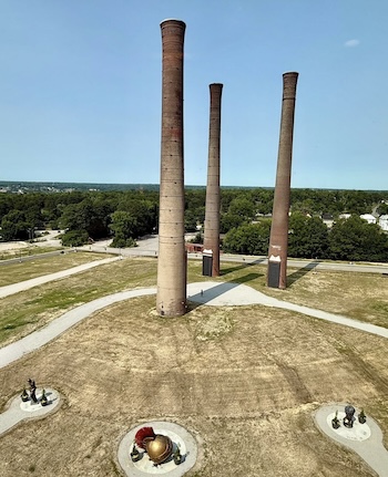 "Three Stacks" with art pieces in the foreground - smokestacks in Danville, Virginia. By Kari Smith