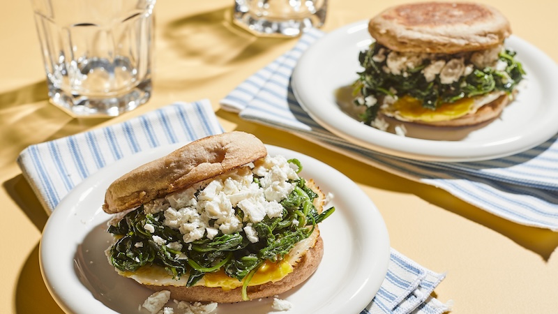 The delicious traditional Greek savory pasty gets a morning twist in these tasty Spanakopita Breakfast Sandwiches. Wilted spinach and arugula add color and balance, feta cheese emphasizes the Greek inspiration, and a fried egg adds a boost of protein. (Jason Donnelly/TCA)