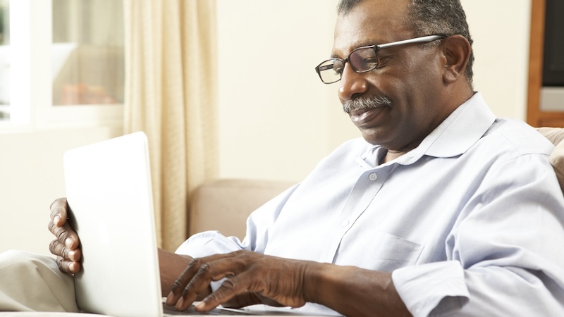 Man on a laptop. Image by Monkey Business Images. Used with Boggle puzzle of words starting and ending with E