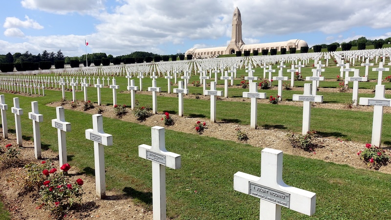 Red roses decorate gravestones in a military cemetery near Verdun, one of World War I's deadliest battlefields and the inspiration for Veterans Day.