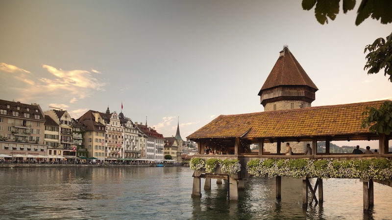 Covered and filled with paintings, Lucerne’s Chapel Bridge zigzags its way across the Reuss River. CREDIT: Dominic Arizona Bonuccelli, Rick Steves’ Europe