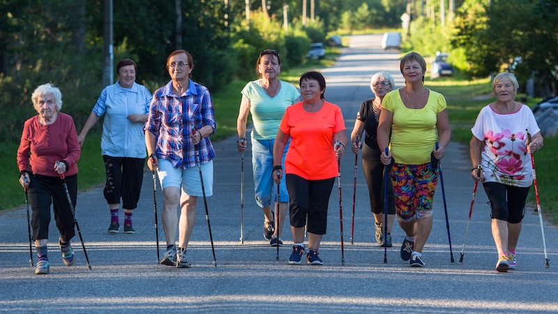 A group of older women exercise walking despite arthritis. Image by Dimaberkut