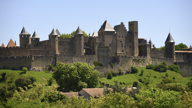 With its 52 towers, witch-hat turrets, and nearly two miles of ramparts, Carcassonne is France’s ultimate walled city. CREDIT: Cameron Hewitt, Rick Steves’ Europe. Tips for visiting the fortified medieval town of Carcassonne in Languedoc, France,