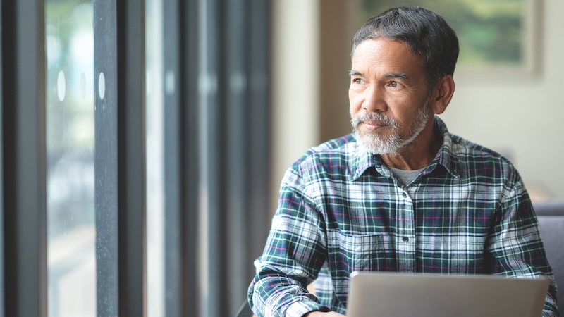 A worried man looks out the window. Image by Teeraphat sirisatonpun. A woman whose husband is a naturalized citizen is concerned about what could happen to him given the sweeping immigration crackdown in the US, but her friends lack empathy for her concerns.