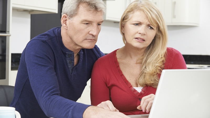 A couple is worried about their finances as they peer anxiously at a laptop. By Ian Allenden. Whether the US economy is healthy now or not depends on who you are.