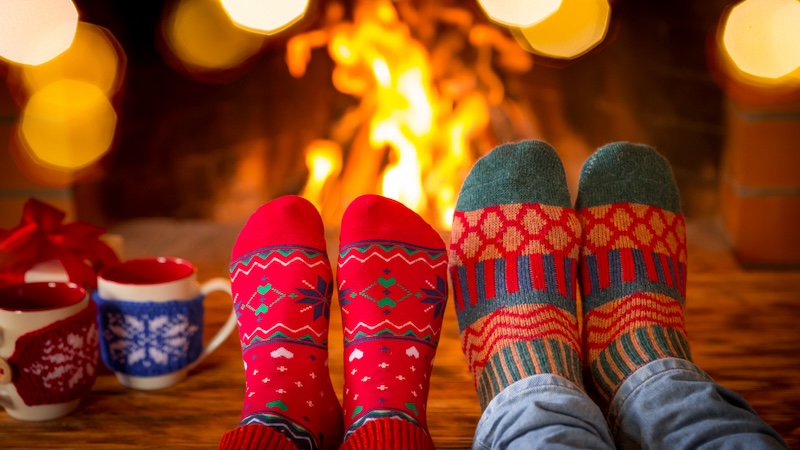 Toasty socks in front of a fireplace, for What's Booming, December 23 + - Credit Yarruta
