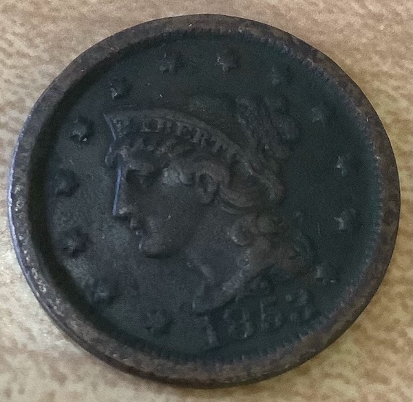 The penny: an 1853 large cent penny