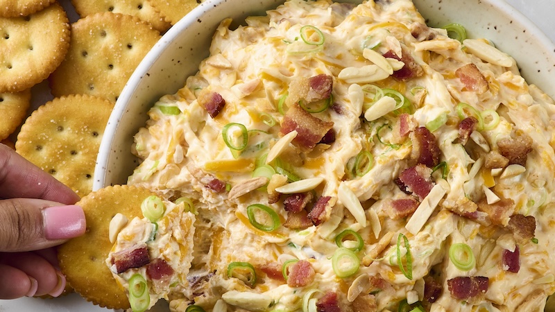 Million-dollar dip is a creamy, cheesy dip loaded with bacon, toasted almonds, and a hint of spice, perfect for parties or snacking. (Alex Lepe /TCA)