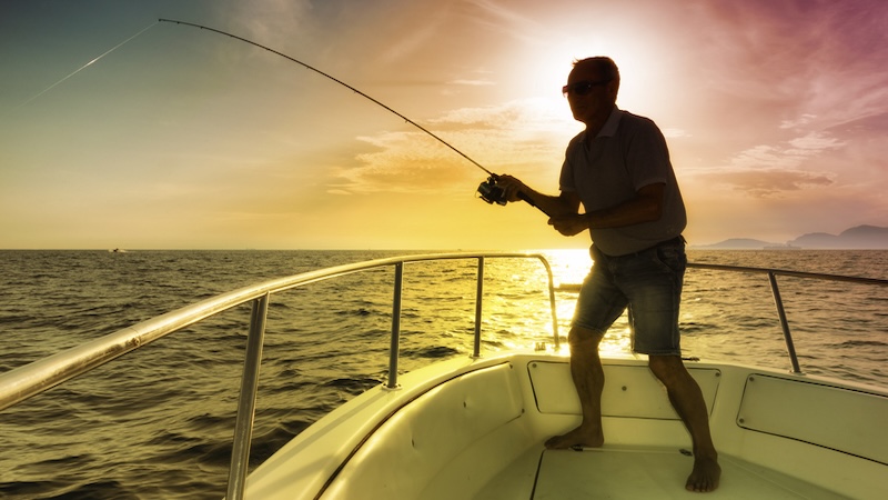 A man fishing from his boat. By Ilfede. What's Booming: antiques and boats