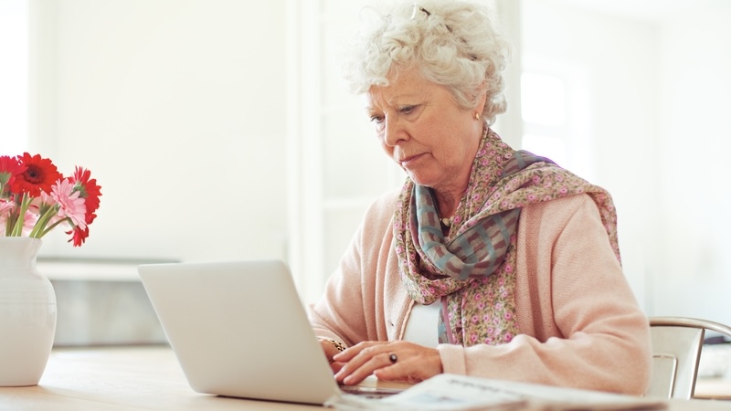 Woman on a laptop, by ammentorp, perhaps playing a Boggle like the one chasing countries